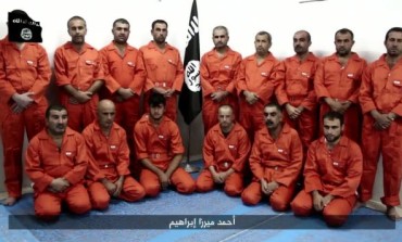 Hours after shocking world with desert execution of 300 Syrian soldiers, ISIS parade captured Kurds then behead one on video