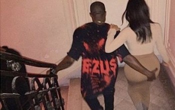 Photos: Kanye West grabs his wife's massive butt