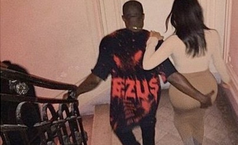Photos: Kanye West grabs his wife’s massive butt