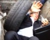 Not Nice: Ex-minister thrown into rubbish bin by angry mob (photos)
