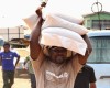 WOW! SEE T.B. Joshua carrying Three Bags of Rice on His Head
