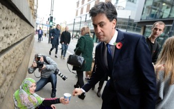 Lol! Ed Miliband dropped just 2p into a beggar's cup in Manchester