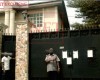 Dbanj's alleged N60m Debt Mess-See Photos of Court Summons pasted on his house..
