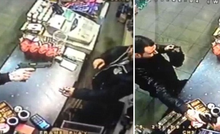Incredible moment fearless shopkeeper snatches gun out of raider’s hand before chasing him out of the store