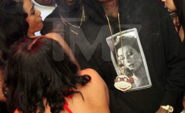 Exactly father of the year! TMZ releases pics of Wiz Khalifa strip clubbing