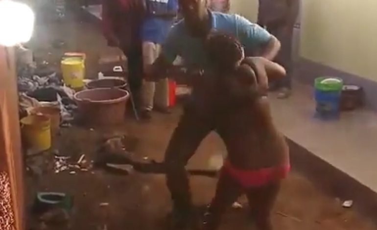 Photos: Neighbours stand and watch as man beats his wife almost to death for cheating