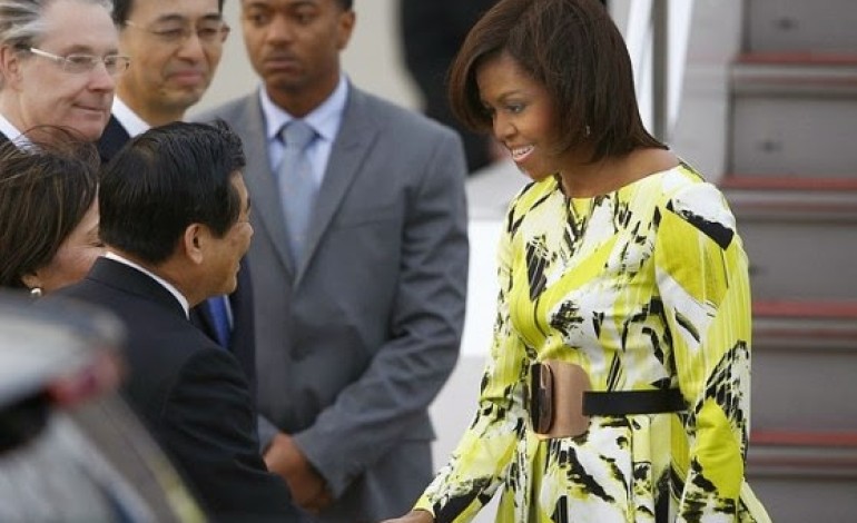 Michelle Obama stuns in floral Kenzo dress as she arrirves Japan