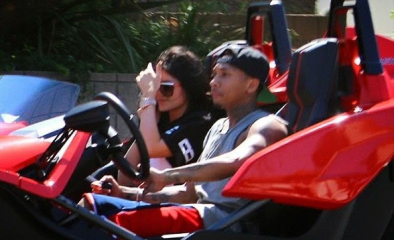 What breakup up? Tyga takes Kylie Jenner for a spin in his 3-wheel motorcycle