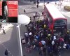 Amazing moment up to 100 people lift double decker bus off trapped unicyclist