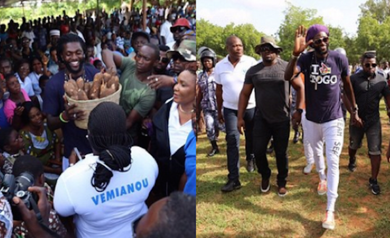 Photographs: Emmanuel Adebayor mobbed by fans on landing in Togo