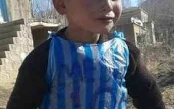Remember the little boy pictured wearing a plastic bag with 'Leo Messi 10' written on it? He's been found!