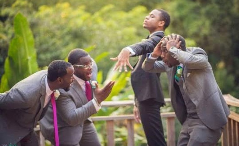 Aww…Check out this wedding photo…groom is proudly showing off his ring