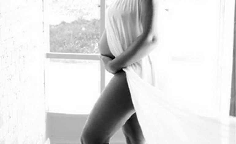 Footballer Uche Kalu’s wife, Ada, shares photos from her pregnancy shoot