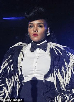 Singer Janelle Monáe reveals her cousin was killed by a spray of bullets while sleeping at home