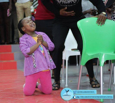 Wow! Little girl pictured down on her knees and in tears as she prays and worships God