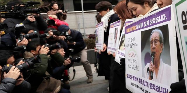 Participants pay a silent tribute to Kim Bok-dong, one of many former South Korean sex slaves for the Japanese military during World War II, near the Japanese Embassy in Seoul, Jan. 30, 2019. (Associated Press)