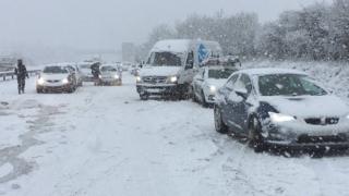 UK weather: Travel warnings after night of snowfall