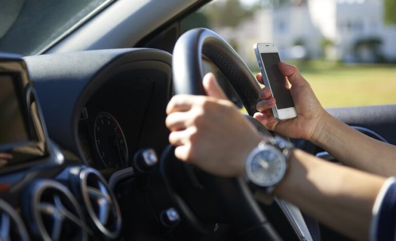 Drivers to be banned from picking up mobile phones