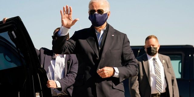 Democratic presidential candidate former Vice President Joe Biden arrives to board his campaign plane at the New Castle Airport in New Castle, Del., Sunday, Oct. 18, 2020, en route to Durham, N.C. (Associated Press)